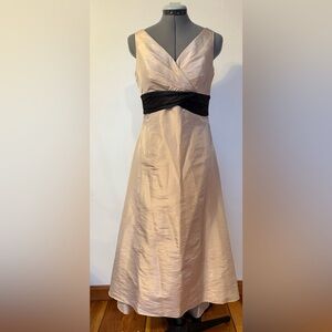 Beige v-neck, tea length,  A-line dress with black  waistband sash.  Size 6